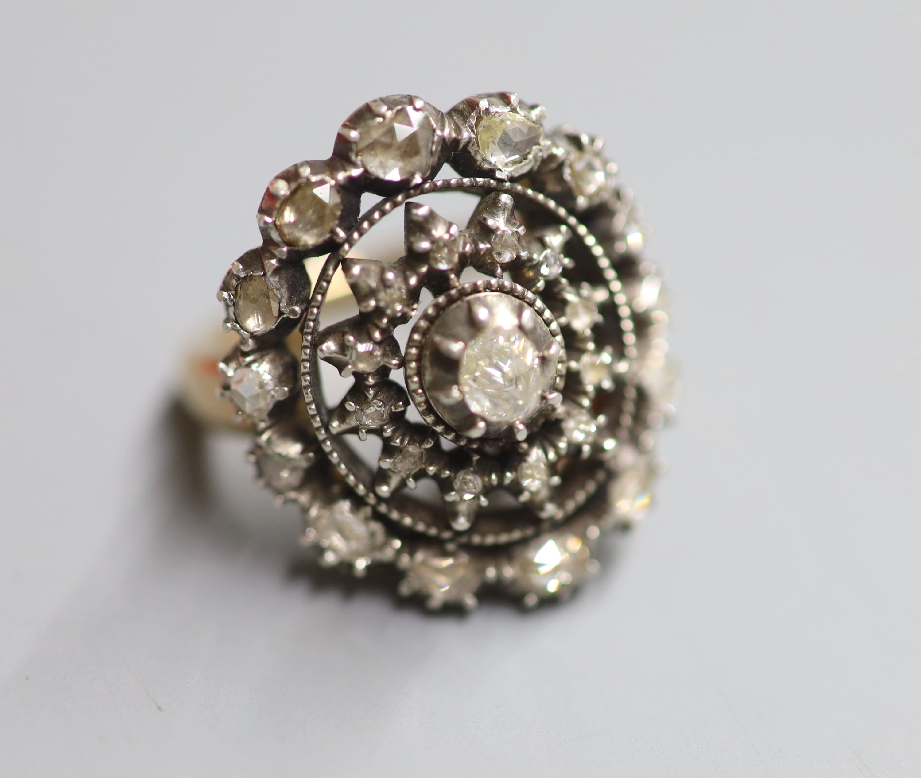 An antique yellow and white metal, rose cut diamond set dress ring, size P/Q, gross 15.6 grams.